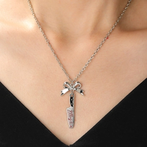 Gothic punk dagger necklace with a bow pendant and Killing It red engraving
