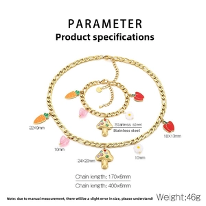 Detail of 18k gold plated stainless steel jewelry set with mushroom and carrot charms