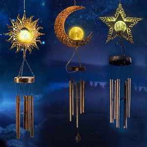 Solar wind chimes with glowing glass spheres in sun moon and star metal designs