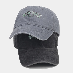 Detail of gray and black washed cotton baseball caps with New York USA embroidery