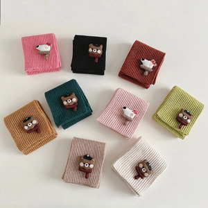 Cute knitted children's scarves with cartoon dog patches in various warm colors