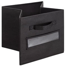 Foldable black fabric storage box with reinforced handle and clear label slot detail