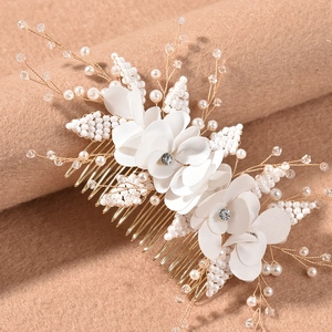 Elegant floral bridal hair comb with white fabric flowers and pearls on gold wire