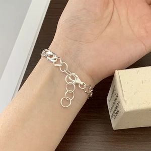 S925 sterling silver geometric chain bracelet worn on wrist with adjustable clasp