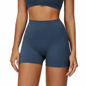 High-waisted navy blue yoga shorts and sports top set in high-elasticity matte fabric