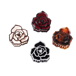 Set of four glossy resin rose flower hair claws in red, cream, black, and amber shades