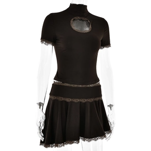 Detail of black lace trim and hollow-out design on high-neck top and pleated skirt set