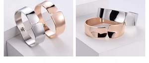 Polished silver and rose gold cuff bracelets with spring hinges and mirror finish surface