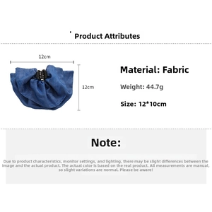 Detail view of blue denim fabric hair claw clip with 12cm size dimensions and pleats