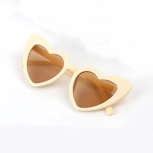 Fashionable heart-shaped children's sunglasses with cream frames and amber lenses
