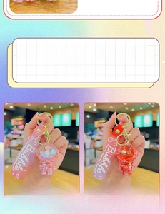 Close-up of pink and red liquid astronaut keychains with floating glitter and wristbands
