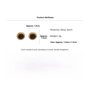 Detailed close-up of retro round tiger-eye style resin earrings with golden rope borders