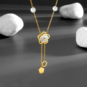 Minimalist gold titanium necklace with pearl accents and camellia shell flower pendant