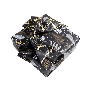 Luxury Christmas gift box with black gold pattern and elegant ribbon bow for flowers
