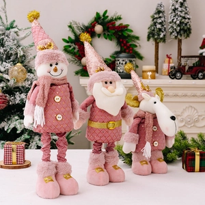 Pink and gold sequin Christmas plush figures featuring Santa, Snowman, and Reindeer dolls