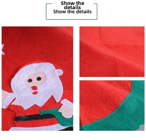 Detail of Christmas tree skirt featuring Santa Claus applique and wavy green borders