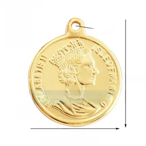 Macro view of double-sided gold Elizabeth II and Dos Pesos coin pendant for jewelry making