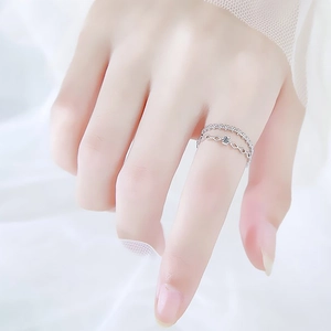 Double-layer lace style silver ring with geometric hollow pattern and sparkling zircons