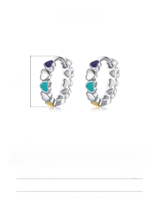 Macro detail of S925 sterling silver colorful enamel heart hoop earrings 13.50mm diameter