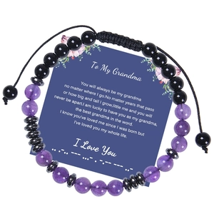 Detail of adjustable Morse code bracelet with purple natural stones on message card