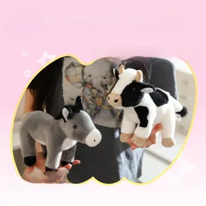 Close-up of soft plush cow and donkey toys showing thick skin-friendly fabric texture