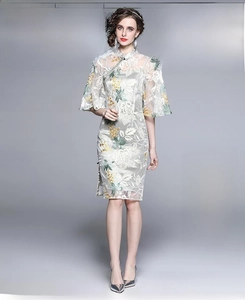 Detail of grey retro qipao dress featuring delicate floral embroidery and mandarin collar