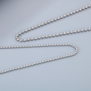 Macro close-up of shiny silver stainless steel bead chain for DIY jewelry making