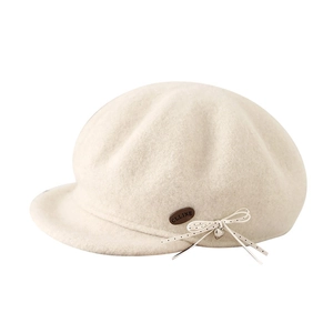 Elegant wool newsboy cap with bow and heart charm for winter, stylish cream color design