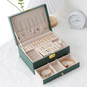 Green double-layer leather jewelry box with drawers, necklace hooks, and security lock