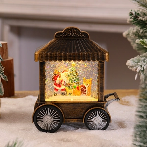 Detail of vintage bronze Christmas carriage lantern with Santa scene and warm lighting