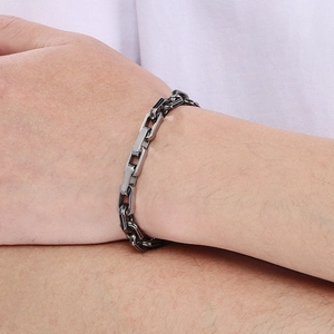 Macro shot of industrial 8mm square link stainless steel chain bracelet on wrist