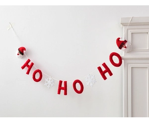 Detailed view of red felt HO HO HO Christmas garland with snowflakes and Santa Claus heads