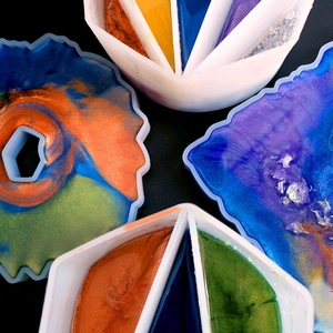 Macro view of silicone resin molds with colorful pearlescent liquid pigments