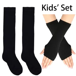 Close-up of kids' black knitted arm warmers and long socks set for dance and warmth