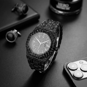 Detail of luxury iced out black men's watch with full zircon setting and date display