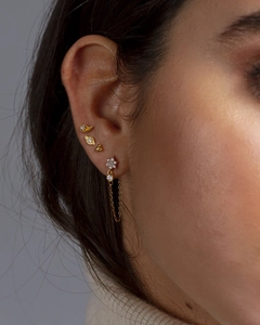 Gold flower stud earring set with sparkling zircon stones and delicate chain tassel detail
