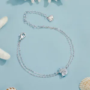 Elegant S925 sterling silver double-layer bracelet with blue conch and starfish charms