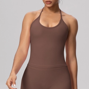 Detail of high-stretch halter yoga bra with open back design in brown color