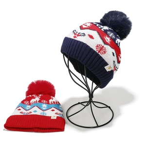 Winter knit beanies for kids with festive reindeer, snowflakes, and large pom-poms