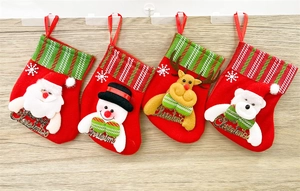 Detail of 4 mini Christmas stockings with Santa, Snowman, Reindeer and Polar Bear figures