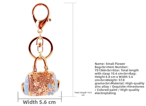 Detail of rose gold flower handbag keychain with champagne rhinestones and blue enamel