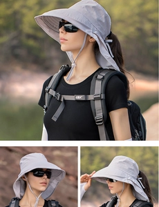 Detail of wide brim sun hat with neck protection flap in light grey for outdoor hiking