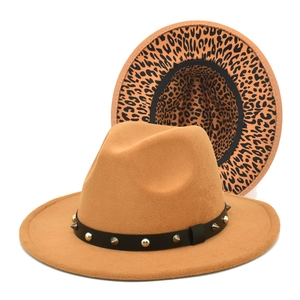 Detail view of khaki fedora hat featuring leopard print brim and studded leather band