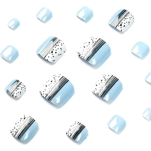 Light blue and white press-on toenails with black polka dots and vertical stripe patterns