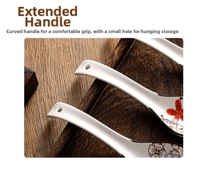 Detail view of a floral ceramic spoon with long curved handle and hanging hole design