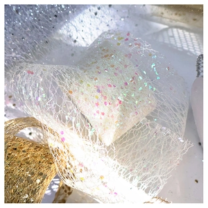 Macro shot of shimmering tulle ribbon with glitter sequins for gift wrapping and DIY crafts