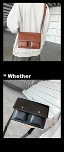 Detail view of retro leather messenger bags in brown and black with double front pockets