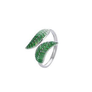 Adjustable silver ring featuring green enamel leaves in a pastoral forest style design