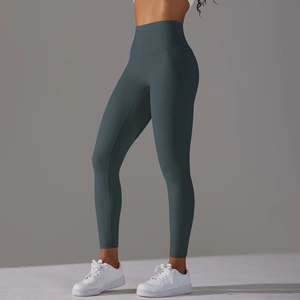 Detail view of high-waist seamless yoga leggings in dark grey-blue with matte finish