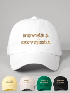 Close-up of Movida embroidery details on five colors of cotton baseball caps